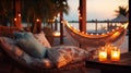 cozy Luxury resort, evening beach, candles blurred light on table ,sofa, hammock on front sunset sea