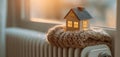 The cozy miniature house perched on a warm radiator in soft evening light AI generated image Royalty Free Stock Photo