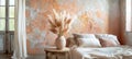 Cozy minimalist interior with earthy tones in 13-1023 Peach Fuzz color featuring vase of pampas grass on rustic wooden table