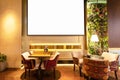 Cozy modern interior of restaurant, teahouse with white projector screenCozy modern interior of restaurant, teahouse with white