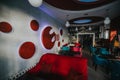 Cozy modern restaurant interior with comfortable soft chairs and beautiful wall decorations
