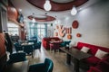 Cozy modern restaurant interior with comfortable soft chairs and beautiful wall decorations