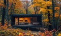 A cozy modern wooden cabin surrounded by colorful autumn foliage Royalty Free Stock Photo