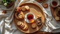 Cozy morning tea with biscuits and nuts on a woven tray Royalty Free Stock Photo