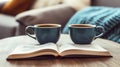 Cozy Morning Two Blue Mugs, Steaming Coffee. and an Open Book Create a Relaxing Moment Royalty Free Stock Photo