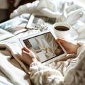 Cozy morning vibes with a warm cup of coffee, snuggled in soft blankets while exploring design inspirations on a tablet
