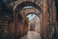 Cozy narrow small Street in the Old City of Jerusalem, Israel. Typical stoned houses and walls of jewish historic Royalty Free Stock Photo