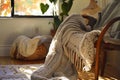 cozy nook with a knitted blanket draped over the chair