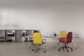 Cozy office interior with a table and colorful chairs, shelf and mockup wall Royalty Free Stock Photo