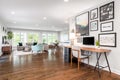 A cozy office looking towards the living and dining room.