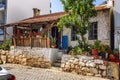 Cozy old brick house in a small European village. Veranda with a garden. Beautiful view Royalty Free Stock Photo