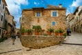 Cozy old street decorated with flower pots in the village Valldemossa, Mallorca Royalty Free Stock Photo