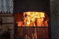 Cozy open fireplace with birch and fire. Royalty Free Stock Photo