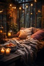 A cozy outdoor evening scene in a countryhouse featuring a warm blanket, pillows, candles and lanterns light bulbs