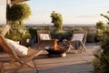 Cozy outdoor roof terrace with armchairs, fire pit and potted plants