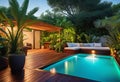 Cozy patio in the back garden with wooden decking, tropical plants and plunge pool. modern design of a place to relax at home, Royalty Free Stock Photo