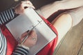 Cozy photo of woman writing in notebook sitting on the floor Royalty Free Stock Photo