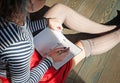 Cozy photo of young woman writing in notebook sitting on the flo Royalty Free Stock Photo