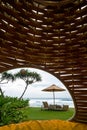 Cozy place inside cocoon hammock. View on tropical indian ocean.
