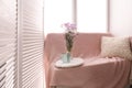 Cozy place for rest near window in light room Royalty Free Stock Photo