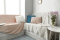 Cozy place for rest near window in light room Royalty Free Stock Photo