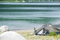 Mountain lake with a tourist tent on the beach