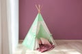 Cozy play tent for kids near window in room