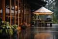 Cozy Rainy Day at a Forest Cabin Porch. Royalty Free Stock Photo