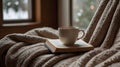 A cozy reading nook with a stack of novels, a soft blanket, a pair of reading glasses, and a cup of tea Royalty Free Stock Photo