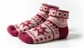 Cozy red and pink knitted socks with star pattern on white background Royalty Free Stock Photo