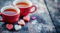 Cozy red teacups with heart-shaped sugar cubes on rustic wood surface Royalty Free Stock Photo