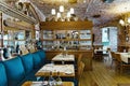 Cozy restaurant interior with restored brickwork and upholstered furniture with Italian cuisine