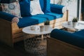 Cozy restaurant interior with wooden blue modern sofas