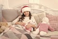 Cozy room. Child waiting christmas in bedroom. Kid lay in bed relaxing. Home is best place in world. Girl little kid Royalty Free Stock Photo