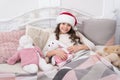 Cozy room. Child waiting christmas in bedroom. Kid lay in bed relaxing. Home is best place in world. Girl little kid Royalty Free Stock Photo