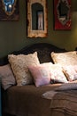 Cozy room interior, bed and lots of pillows Royalty Free Stock Photo