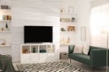 Cozy room interior with stylish furniture, decor and modern TV set Royalty Free Stock Photo