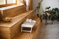 Cozy room with wooden steps near window and tray with cups Royalty Free Stock Photo