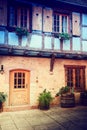 Cozy rustic backyard of traditional timber frame house. Alsace,