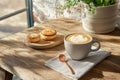 Cozy rustic coffee scene with cappuccino, espresso, pastries in soft morning light Royalty Free Stock Photo