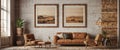 Cozy rustic living room interior with leather sofa, armchairs and framed landscape artwork
