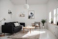 Cozy Scandinavian home living room with kitchen interior design with empty mockup space on white wall. couch, dining table, and ho Royalty Free Stock Photo