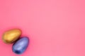 Cozy Set blue and silver Easter eggs on pink background. Top view Royalty Free Stock Photo