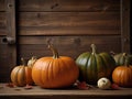 Thanksgiving day autumnal still life with pumpkins on old wooden