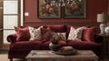 A cozy sitting area features a plush velvet sofa in a rich burgundy color accented with warm throw pillows. The walls