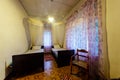 cozy small room in the hotel Villa with transparent canopies over beds, antique furniture. authentic Villa, Asia