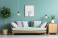 Cozy sofa with mint and white pillows, potted houseplant and wooden cabinet near blue wall with poster and pendant light