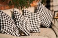 Cozy sofa with plaid cushions. Warm home environment Royalty Free Stock Photo