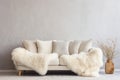 Cozy sofa with white furry sheepskin. Generative AI