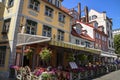 Cozy square with tables of decorated flowers street cafe in Riga, Latvia